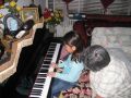 Alexa playing piano with tita Vic